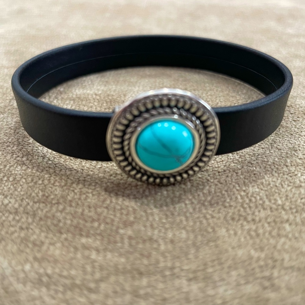 Premium black leather bracelet with turquoise magnetic clasp. Bracelet size 7”.